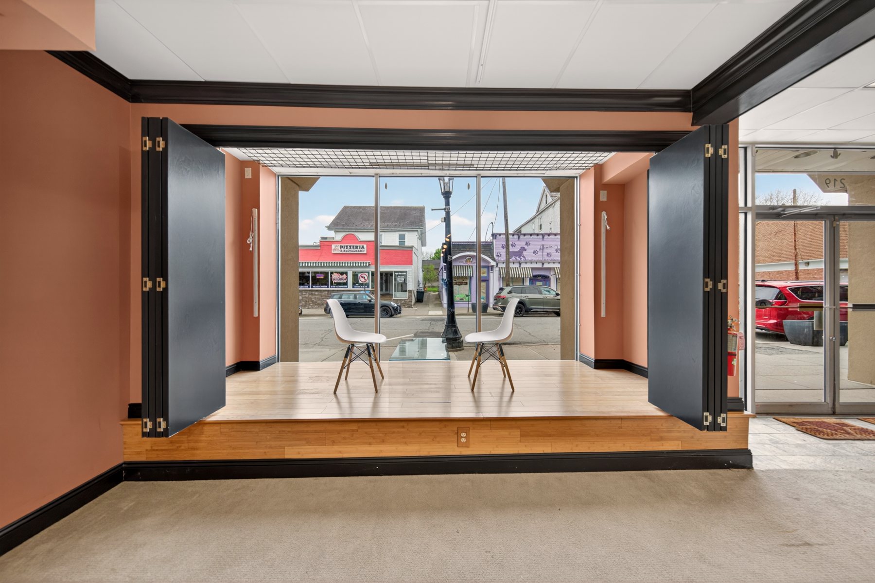 Street-facing stage and storefront windows at 219 Studios on Spring Street